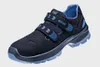 A single black and blue safety shoe with velcro straps is shown against a light gray background. Náhled obrázku produktu
