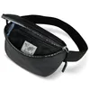 A black belt bag is shown with its main compartment open, revealing interior pockets and a label. Anteprima dell’immagine prodotto