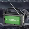 A portable radio with a large battery display, set against a dark, mountainous background. Produktbild-Vorschau
