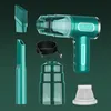 A cordless handheld vacuum cleaner and its accessories are arranged on a green background. Produktbild-Vorschau