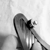 A hand holding a part of a car mudguard with a bolt and washer. Anteprima dell’immagine prodotto