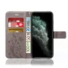 A gray flip phone case for an Apple iPhone 11, shown open with cards and euro banknotes inserted, and the phone screen displaying a nature image. Produktbild-Vorschau