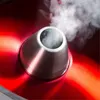 Close-up view of a part of a juicer with steam coming out. Produktbild-Vorschau