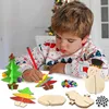 A young boy is crafting Christmas decorations at a table. Produktbild-Vorschau
