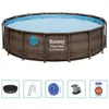 A round above-ground swimming pool with a wicker-like exterior, shown with various accessories below. Produktbild-Vorschau