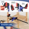 The image shows a WORKPRO clamp being used to hold a wooden shelf, with instructional graphics above demonstrating how to reverse the jaw. Voir les images du produit