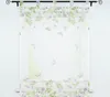 A sheer curtain with a floral and butterfly pattern hanging on a curtain rod. Produktbild-Vorschau