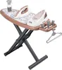 A toy ironing board set with two toy irons, a spray bottle, and hangers. Produktbild-Vorschau