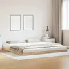 A bedroom scene with a bed frame and mattress. Voir les images du produit
