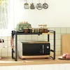A kitchen counter with a microwave and a shelf above it. Produktbild-Vorschau