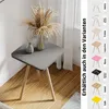 A square side table with wooden legs, decorated with a vase of dried flowers and a diffuser. A collage of different table variations is shown on the right side. Produktbild-Vorschau