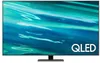 A Samsung QLED smart TV is displayed on its stand against a black background. Produktbild-Vorschau