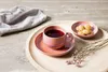 A cup of tea and cookies on a wooden tray with a napkin and dried flowers. Náhled obrázku produktu