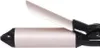 A close-up side view of a curling iron. Anteprima dell’immagine prodotto
