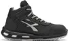 A side view of a black and gray high-top safety shoe. Produktbild-Vorschau