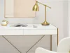 A white desk with a gold lamp, a book, and a mug. Anteprima dell’immagine prodotto