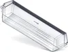 A clear, well-lit studio shot of a transparent plastic refrigerator door shelf, angled to show its shape and interior ridges. The background is plain white. Produktbild-Vorschau