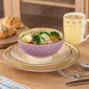 A table setting with a bowl of salad, croissants, and a mug. Náhled obrázku produktu