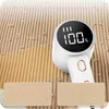 A close-up marketing image showing a fabric shaver removing lint from a beige fabric. The device has a digital display showing '100%'. Two inset boxes show a 'before' and 'after' comparison of the fabric. Náhled obrázku produktu