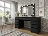 A vanity table with a lighted mirror, a chair, and decorative elements in a room with floral wallpaper. Produktbild-Vorschau