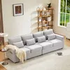 A modern living room with a large gray sofa, a side table, and a bookshelf. Produktbild-Vorschau