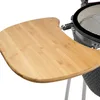 A close-up of a bamboo side table attached to a charcoal grill. Produktbild-Vorschau