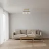 A modern living room with a beige sofa, a wooden coffee table, and sheer white curtains. Náhľad obrázku produktu