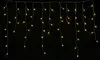 A string of warm white LED lights against a black background. Produktbild-Vorschau