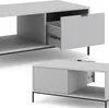 Two views of a modern, minimalist gray coffee table with a fluted drawer front. The top view shows the drawer partially open, revealing the interior and drawer slides. The bottom view shows a similar coffee table from a different angle. Náhled obrázku produktu