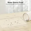A clear screen protector is shown on a wooden surface with water droplets, next to a ribbed glass. Produktbild-Vorschau