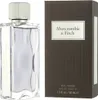 A bottle of Abercrombie & Fitch First Instinct Eau de Toilette for men and its packaging are displayed side-by-side against a white background. Náhľad obrázku produktu