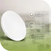 A white, circular LED ceiling lamp is shown at an angle against a blurred background with green and light gray tones. Text overlays provide product specifications. Anteprima dell’immagine prodotto