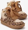 A pair of leopard-print sneakers with fur lining and large brown laces. Produktbild-Vorschau