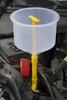 A coolant filling funnel set is placed in the engine bay of a car. Podgląd zdjęcia produktu