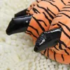 Close-up of tiger paw slippers. Náhled obrázku produktu