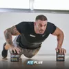 A muscular man is doing push-ups with two containers of supplements on the floor. Anteprima dell’immagine prodotto