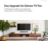 A living room scene with a TV, soundbar, and entertainment center. Anteprima dell’immagine prodotto