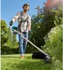 A man is using a string trimmer in a grassy yard with trees in the background. Produktbild-Vorschau