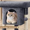 A cat is resting inside a cat house on a cat tree. Produktbild-Vorschau