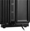 Close-up view of the bottom section of a black electric heater, showing its base, a power cord, and ventilation slots. Náhled obrázku produktu