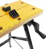 A close-up view of a workbench with black clamps and a measuring tape along the edge. Náhled obrázku produktu