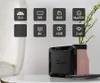 A black multimedia player box is displayed on a table next to a vase with a plant, with feature icons shown above it. Náhľad obrázku produktu