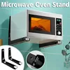 A microwave oven is mounted on a wall using black metal brackets. The text 'Microwave Oven Stand' is overlaid at the top. Produktbild-Vorschau