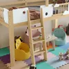 A children's loft bed with various toys and furniture arranged around it, set in a playroom. Produktbild-Vorschau