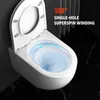 A white wall-mounted toilet with water swirling inside the bowl, set against a dark, marbled floor and a dark gray wall. Náhľad obrázku produktu