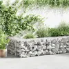 A gabion wall filled with stones and plants in a garden setting. Náhľad obrázku produktu