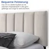 Close-up of a beige upholstered headboard with vertical stitching, with pillows in the foreground. Náhľad obrázku produktu