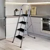A step ladder is placed in a modern kitchen setting. Náhled obrázku produktu
