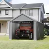 A grey tent garage is set up in a grassy yard next to a house, with an orange SUV parked inside. Náhled obrázku produktu