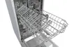 The inside of an open dishwasher with its racks extended. Produktbild-Vorschau